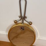 Magnifying brass mirror