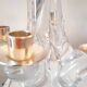 Pair of vintage Schneider crystal and brass candlesticks