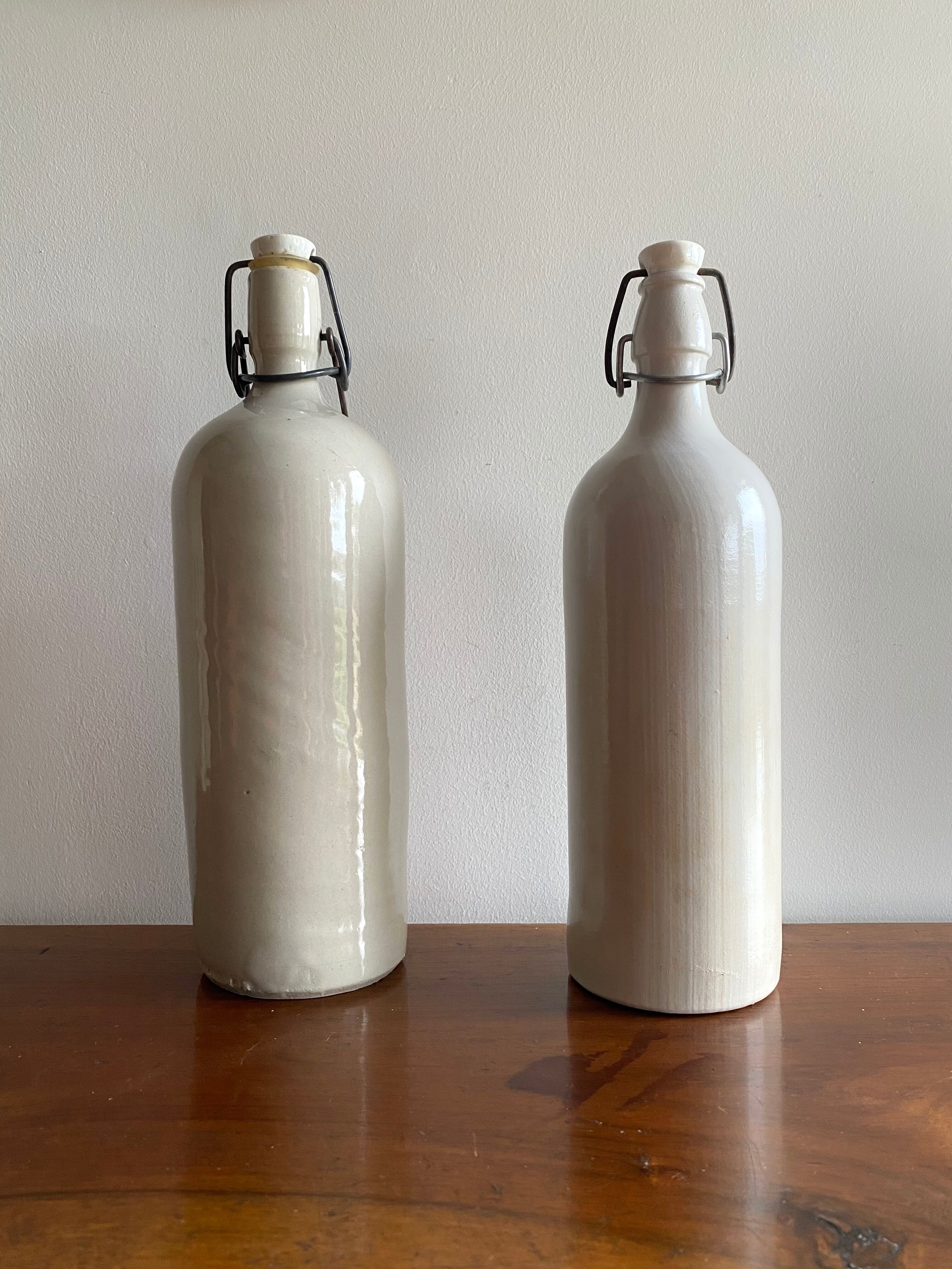 Set of 2 old bottles in glazed stoneware