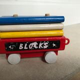 Small vintage train in multicolored wood
