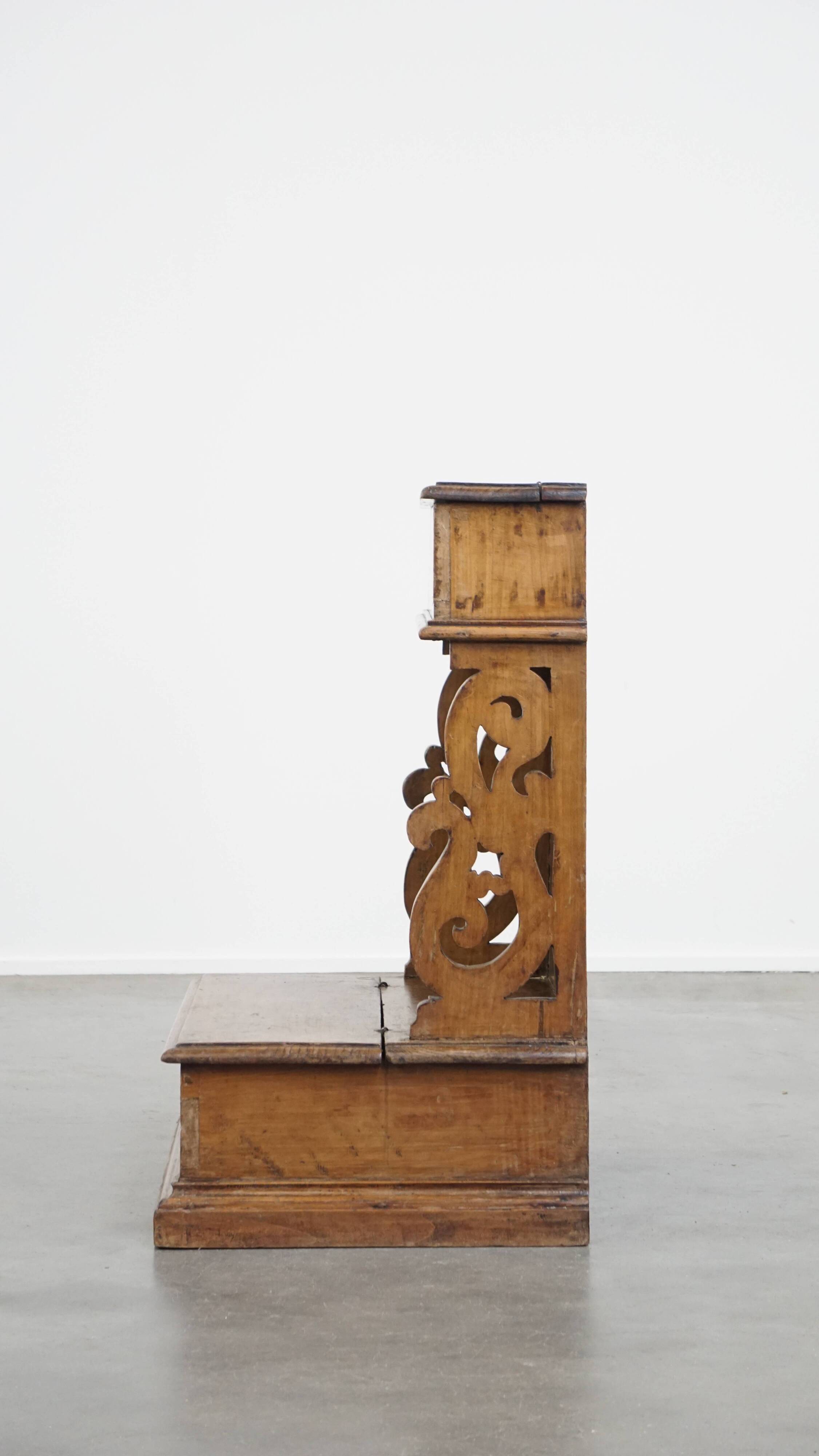 Antique pinewood church pew with storage compartments from the 18th century