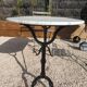 Table bistrot pieds fonte et plateau marbre