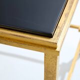 Pair of side tables in gilded iron and black lacquer Maison Ramsay 1950