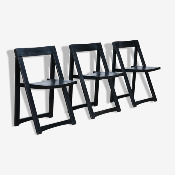 Set of three black folding chairs circa 1980
