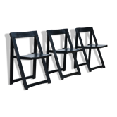 Set of three black folding chairs circa 1980