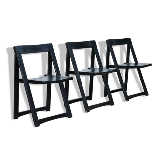 Set of three black folding chairs circa 1980