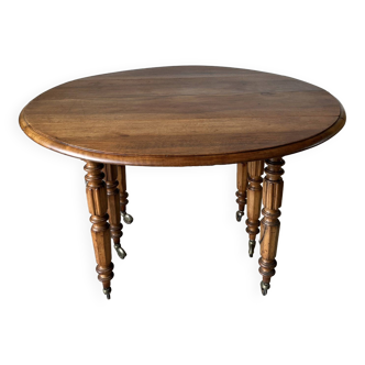 Old round table in solid cherry wood, expandable and folding