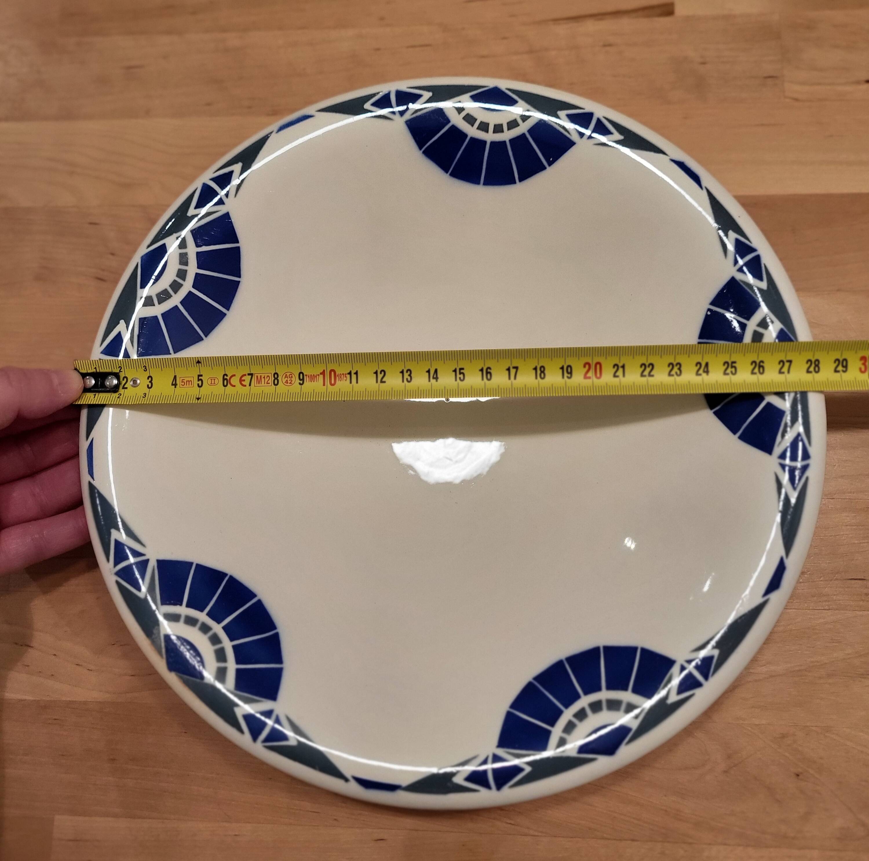 Round service plate demi-void signed Badonviller Thouars Art Deco