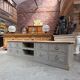 Old workshop furniture transformed into a TV unit.
