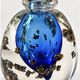Art glass bottle signed Didier SABA, with cobalt blue decoration and inclusions.