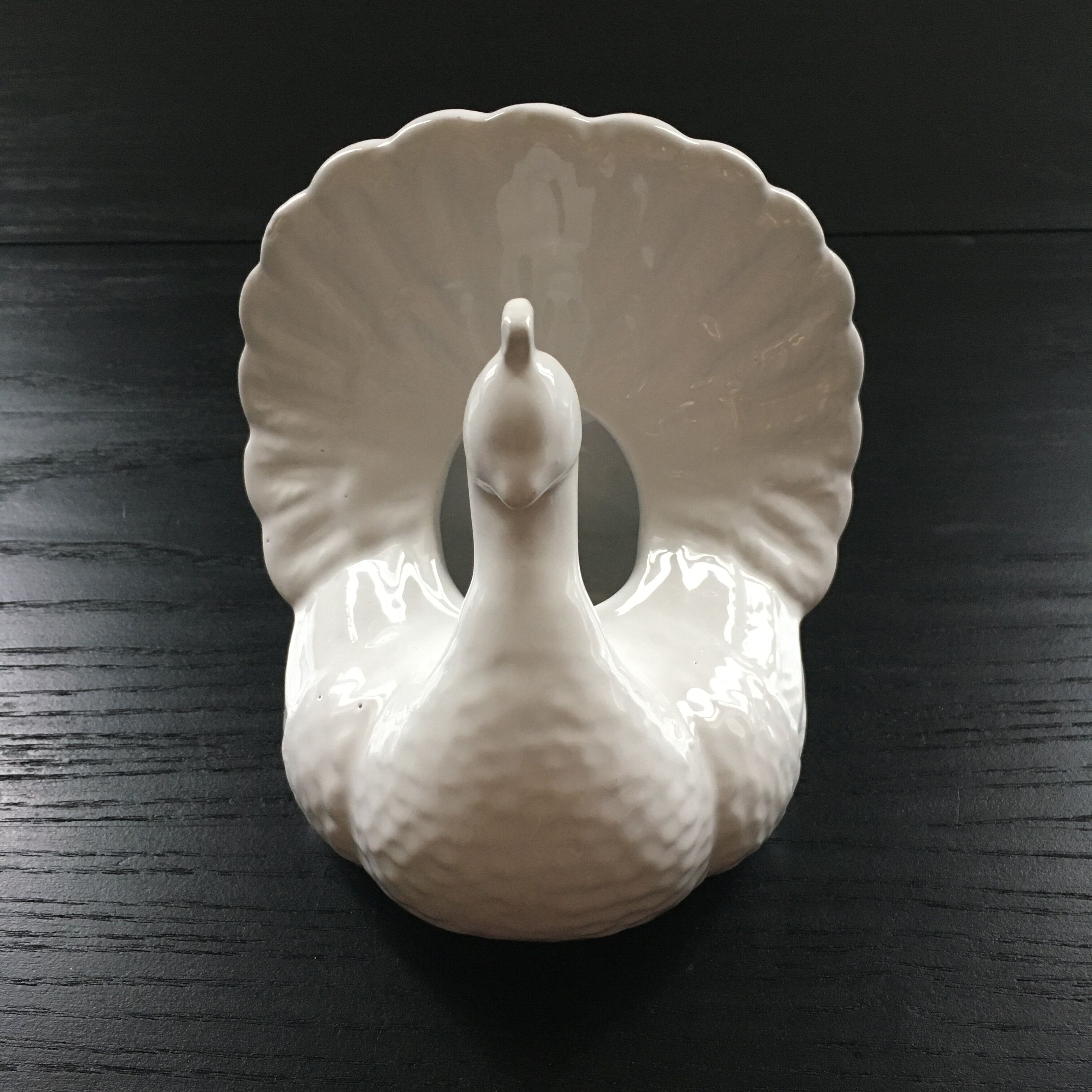 White peacock vase
