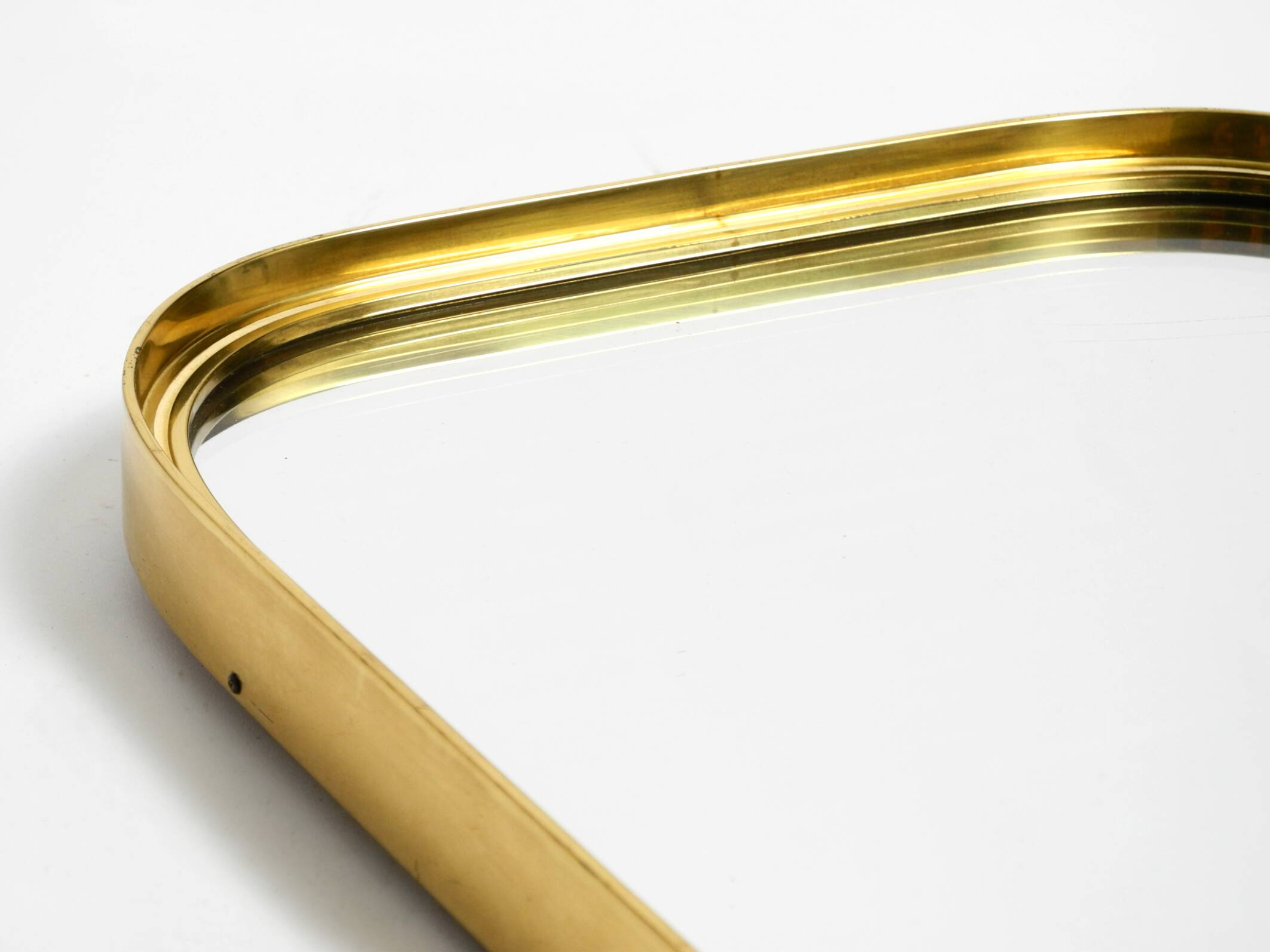 Small solid Mid Century brass wall mirror by Münchener Zierspiegel