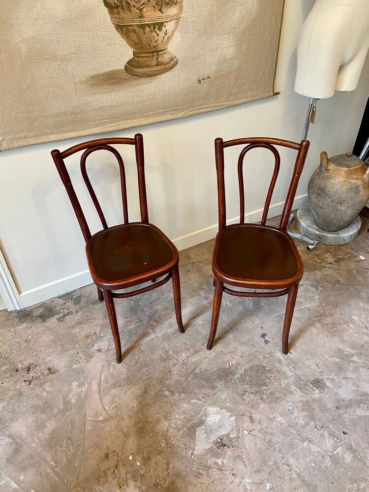 2 bistro chairs in arched and dark wood