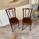 2 bistro chairs in arched and dark wood