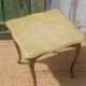 Vintage side table in gilded brass with an onyx top.