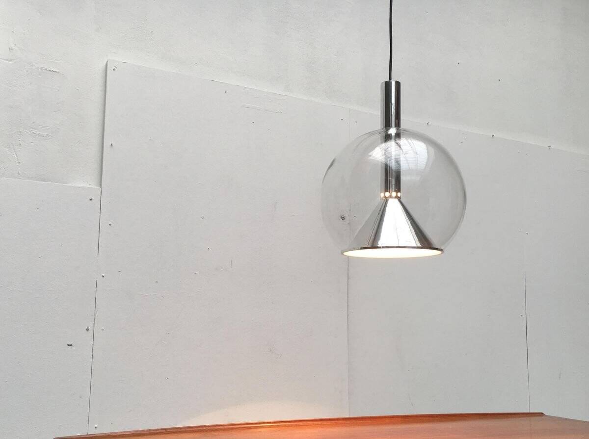 Suspended globe lamp in glass from the German space age by Erco.