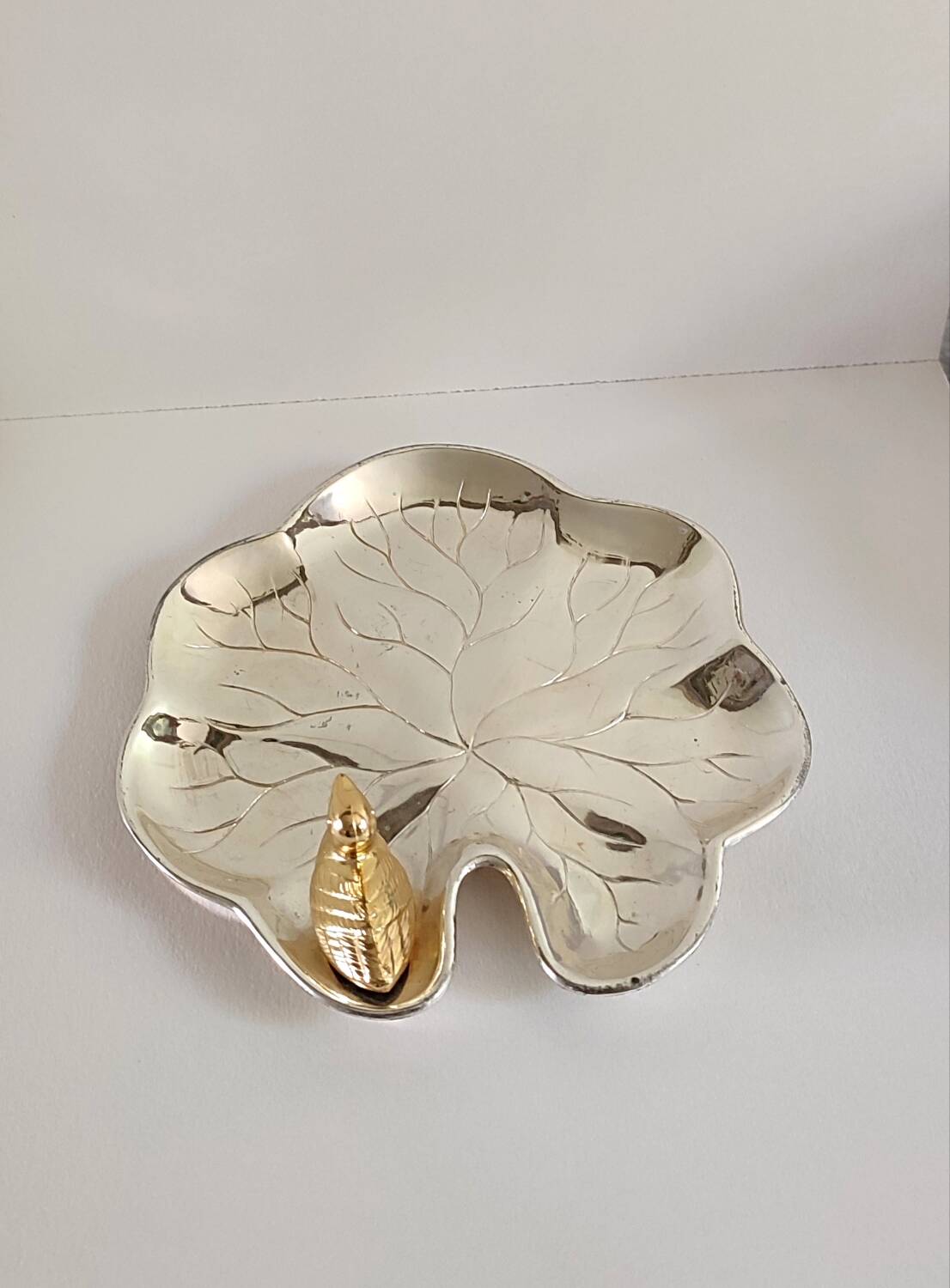 A Lancel pocket tray in silver metal.