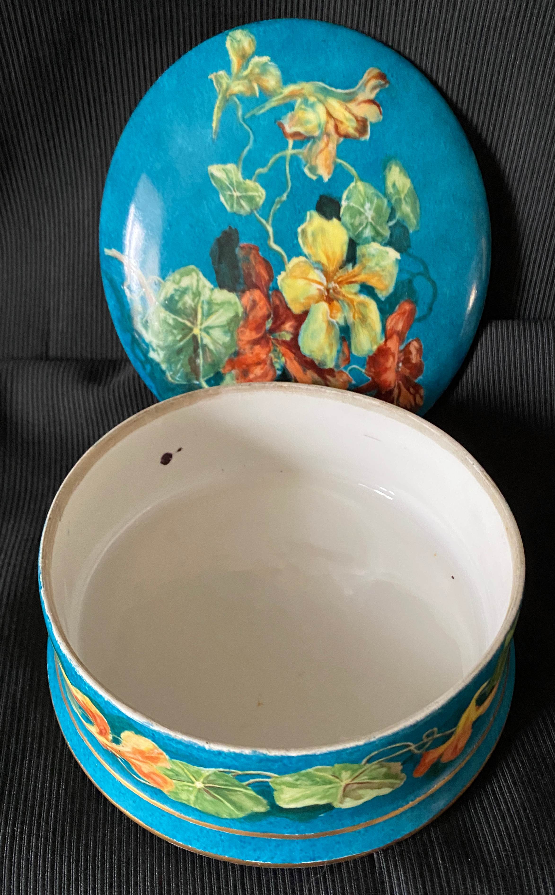 Antique porcelain candy box with floral motifs