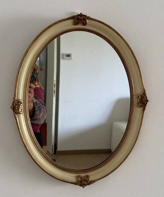 Mirror in wood and stucco with gilded highlights 20th century