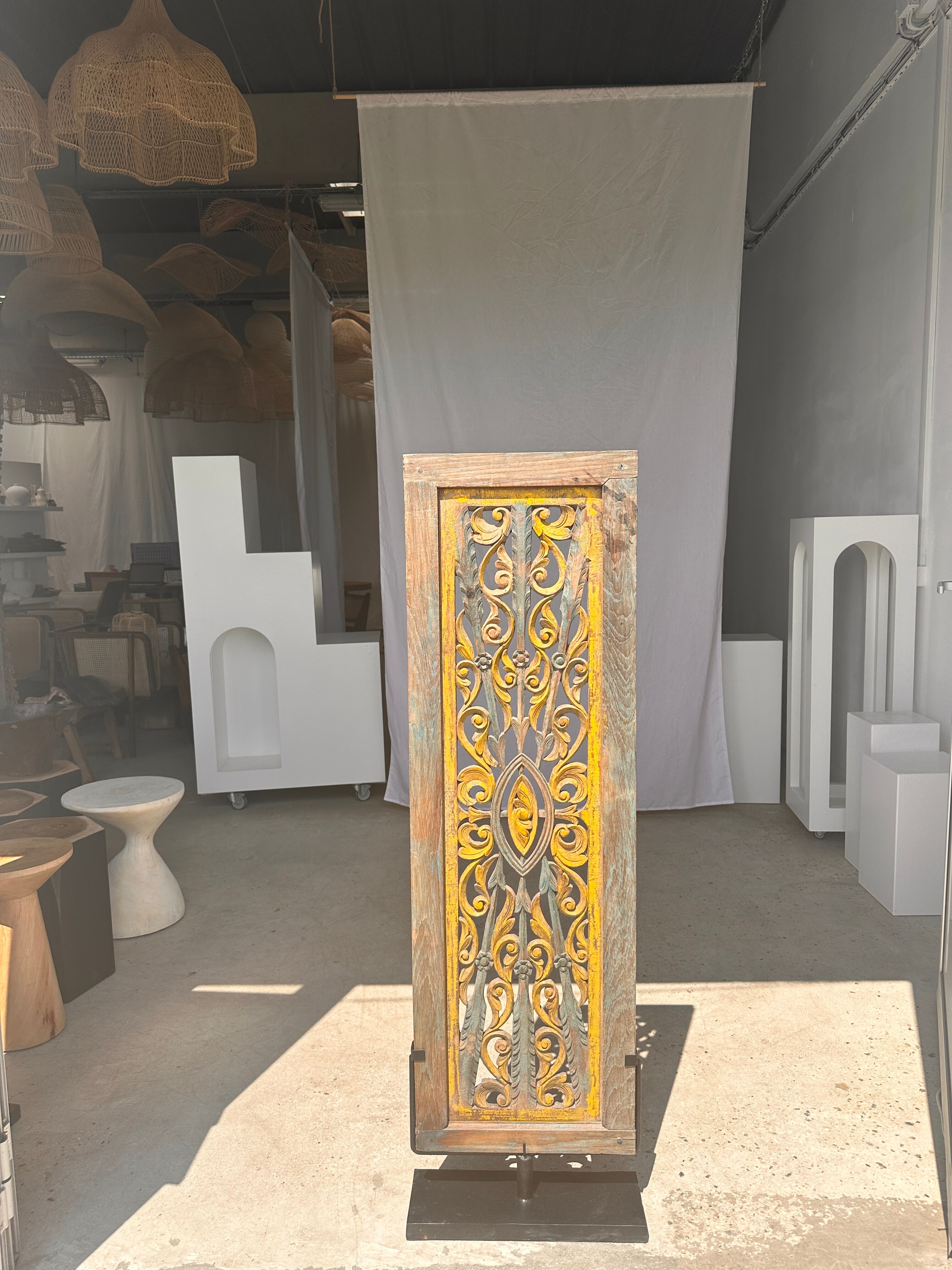 Rectangular Indonesian construction element with blue and yellow plant in carved wood