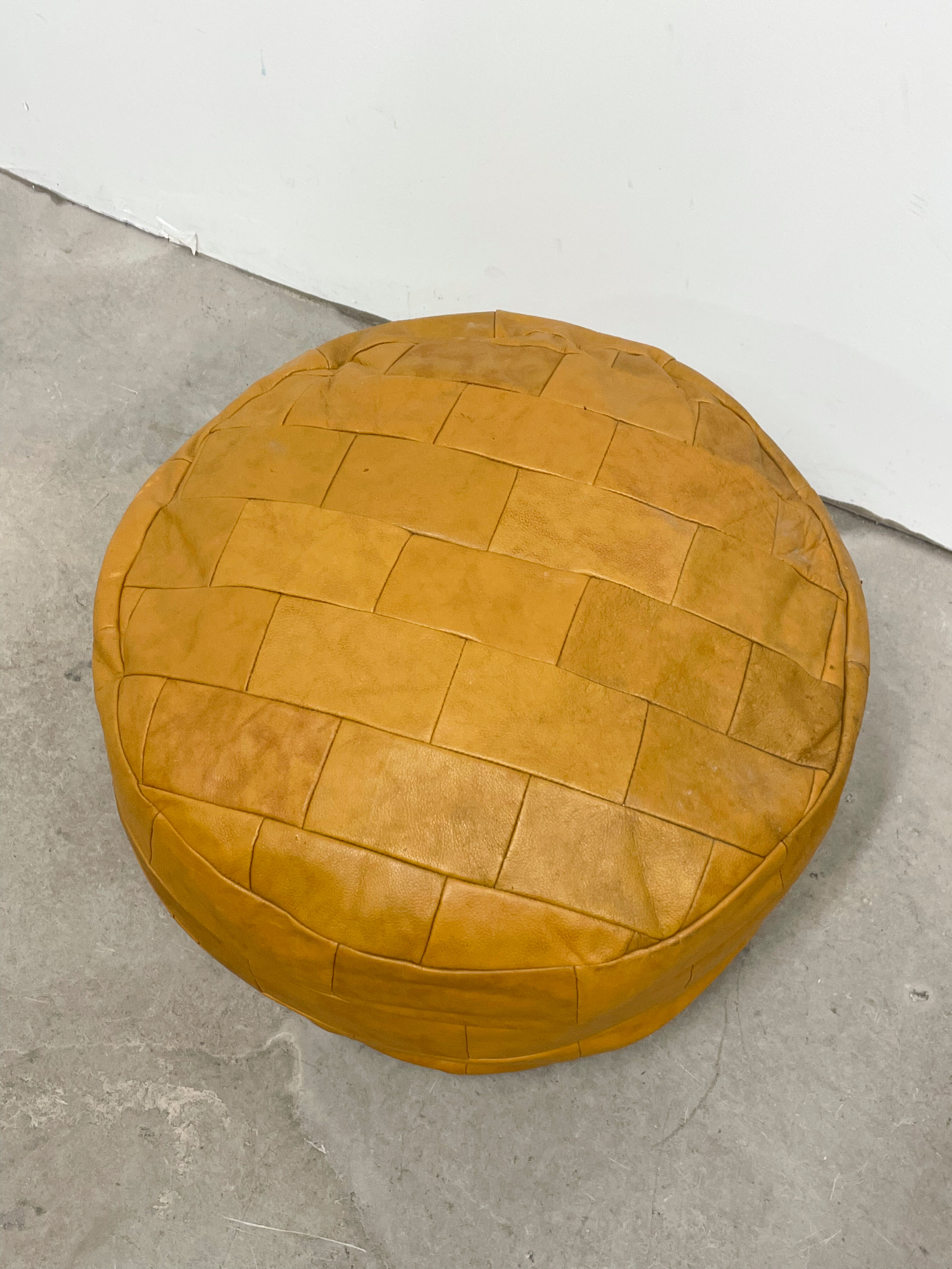 Ochre leather patchwork pouf