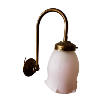 Brass wall lamp with pale pink bell