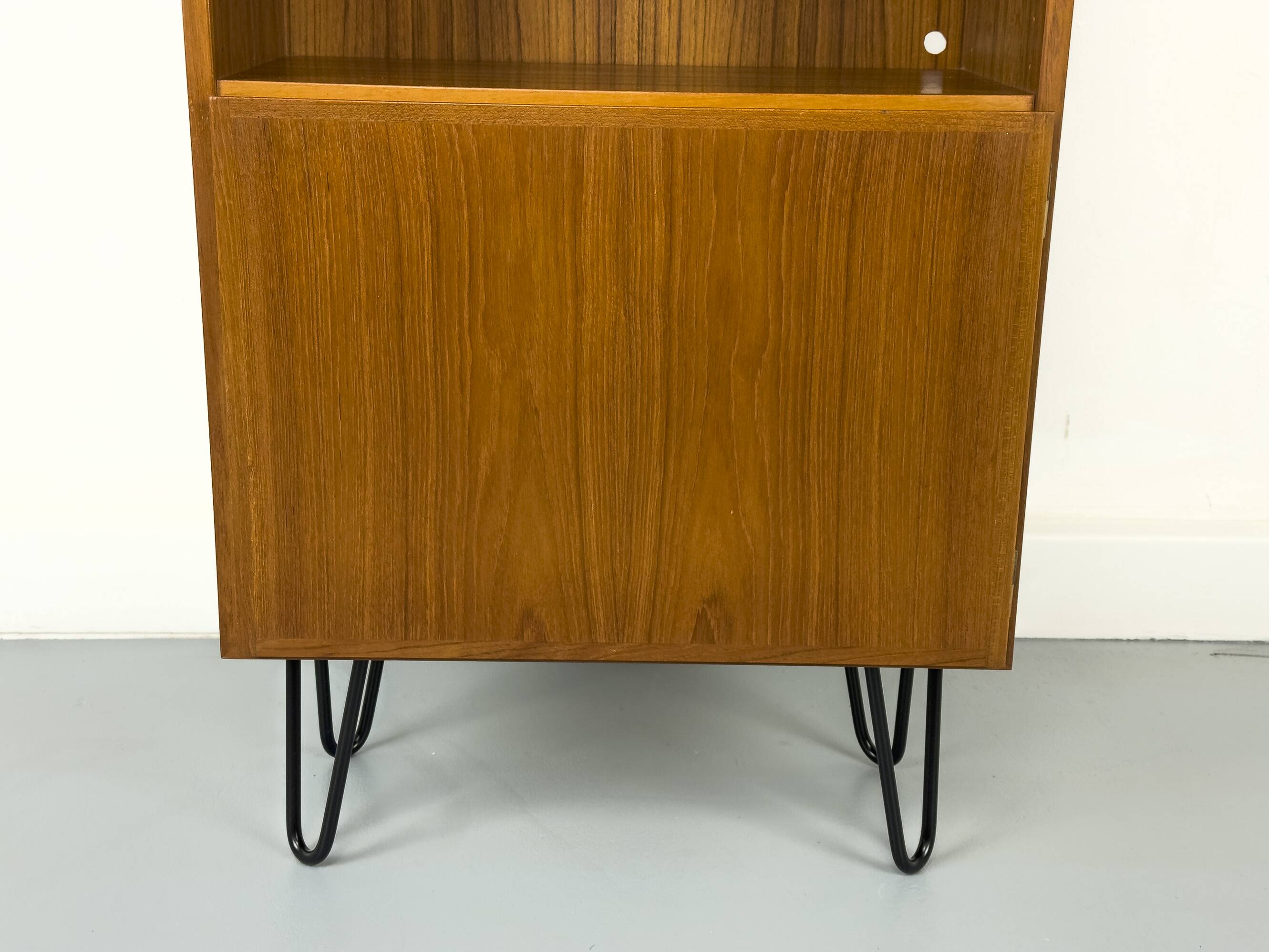 Narrow teak bookcase with two doors by Omann Jun, 1970s
