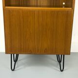 Narrow teak bookcase with two doors by Omann Jun, 1970s
