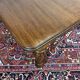 Victorian-style mahogany English table with 3 extensions.