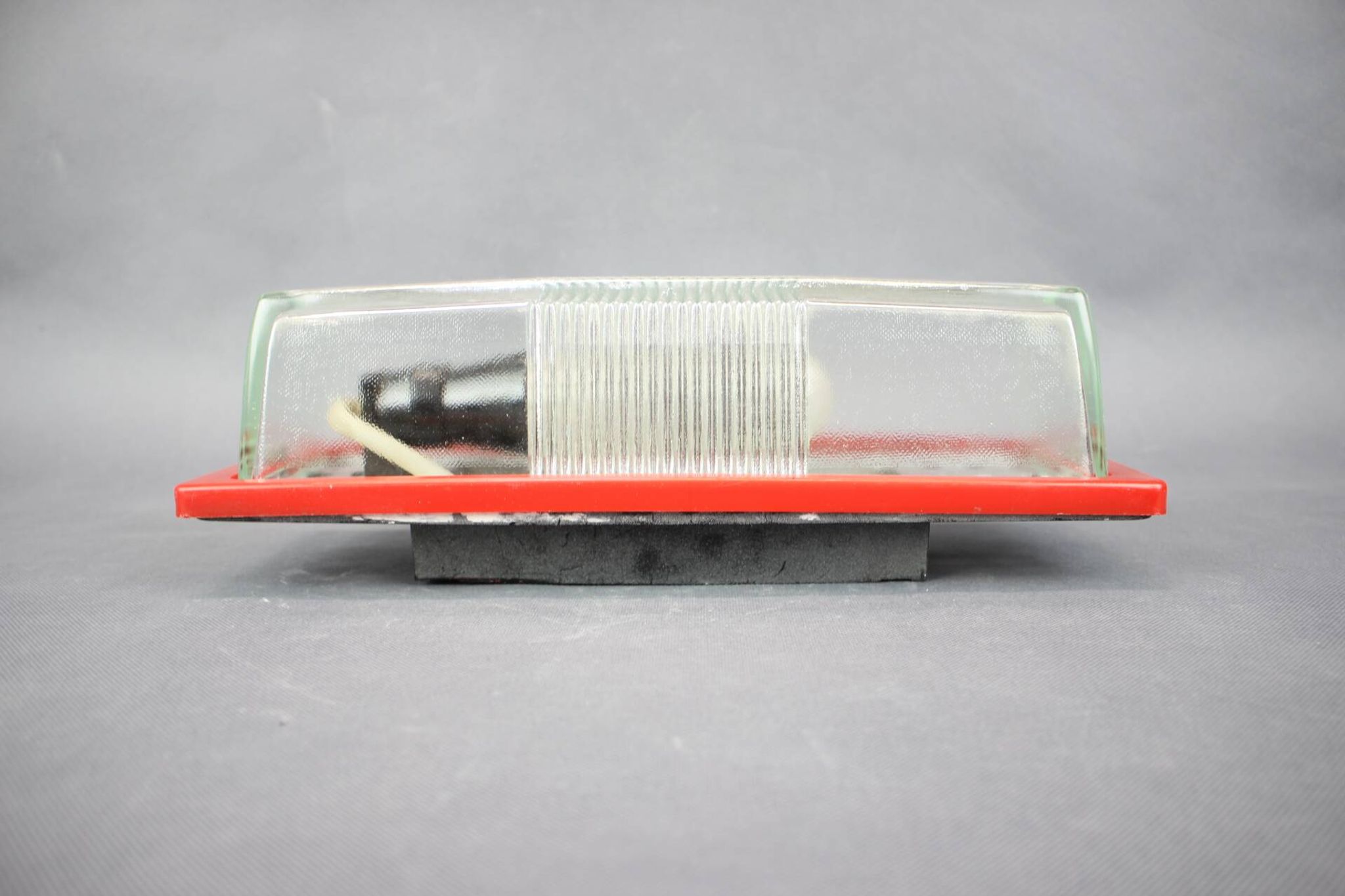 1970s Czech space age wall light with red plastic and glass.