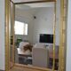 Large mirror with wooden gilded and carved frame.