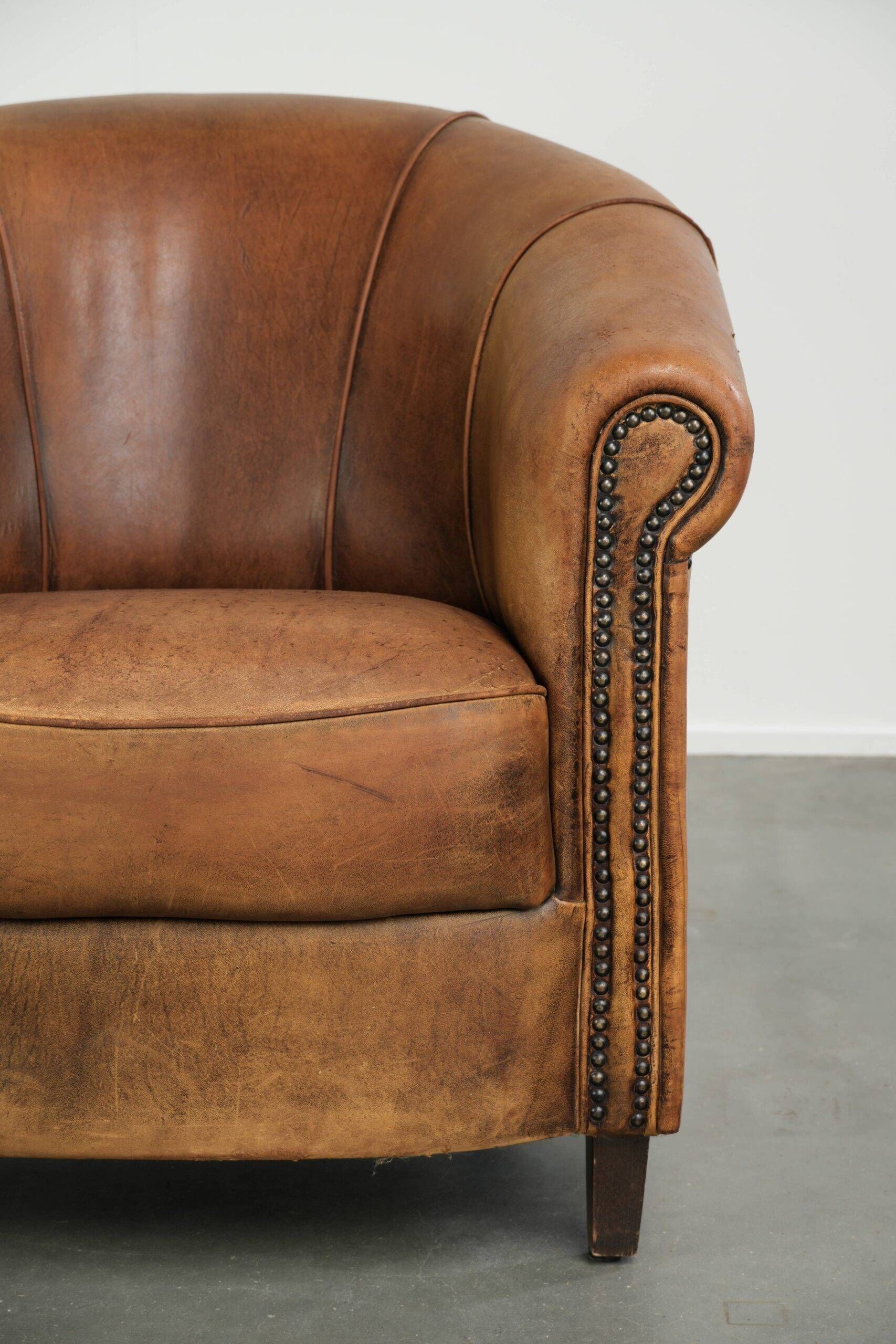 Vintage sheepskin clubchair in a beautiful cognac colour with a sturdy look