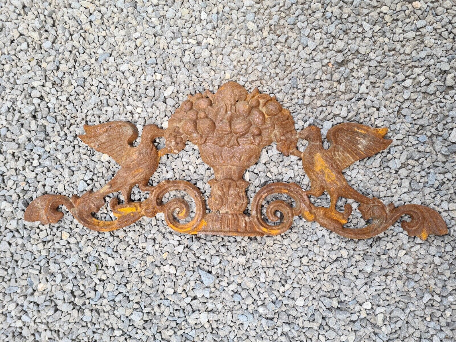 Cast iron pediment with birds