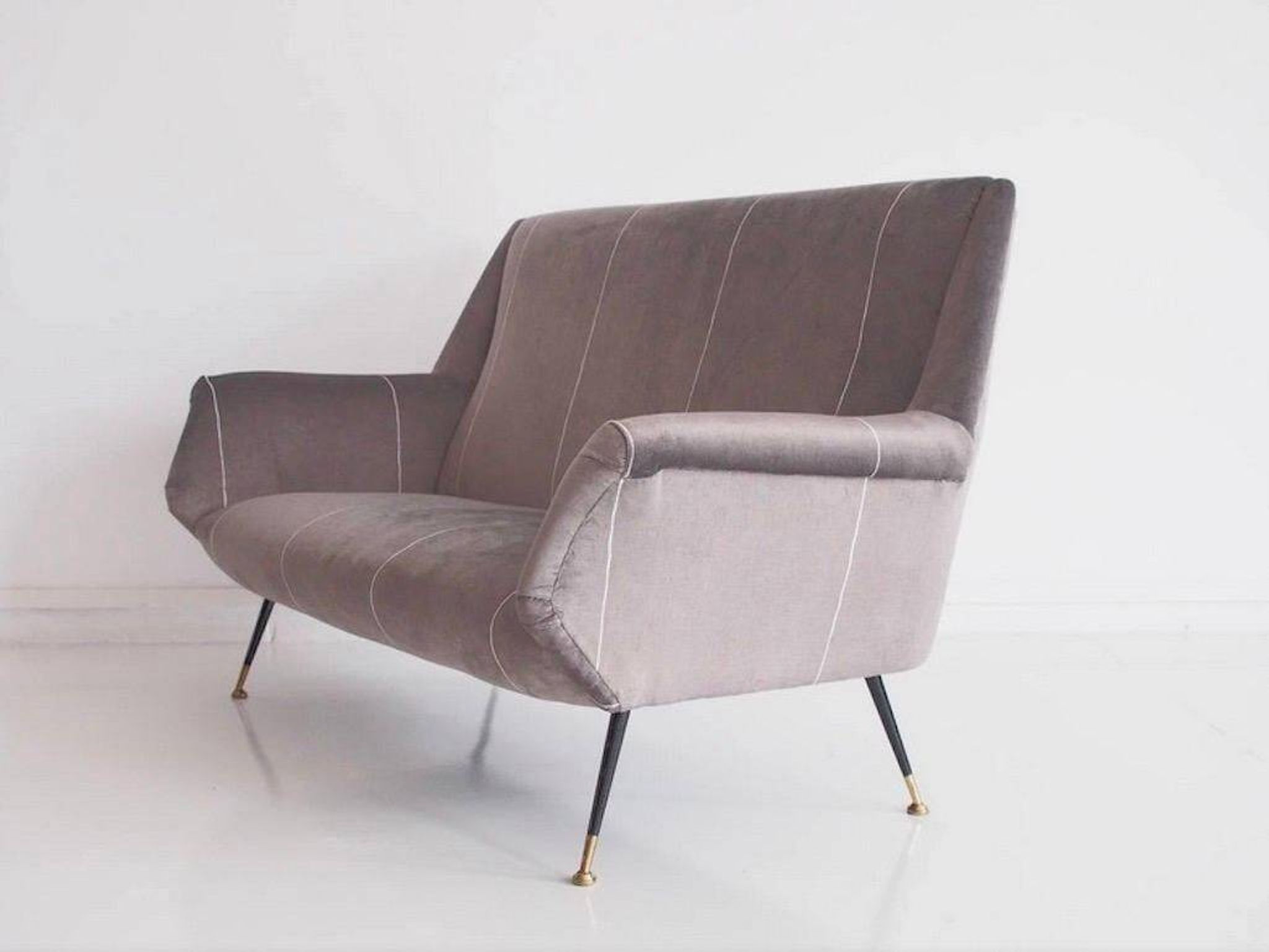 Italian velvet sofa in grey with black lacquered brass legs.