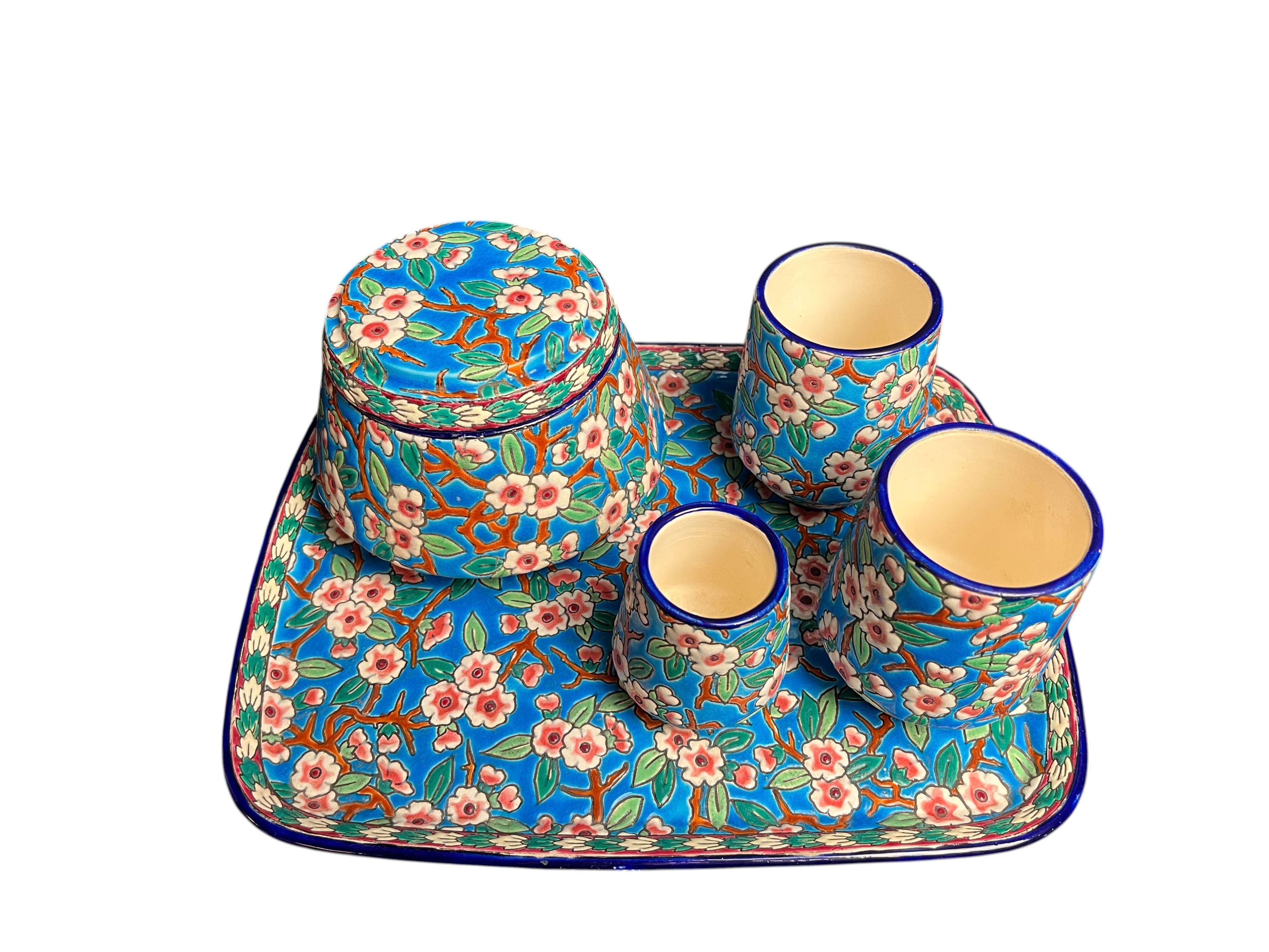 Longwy, cherry blossom glazed earthenware smoking set, early 20th century