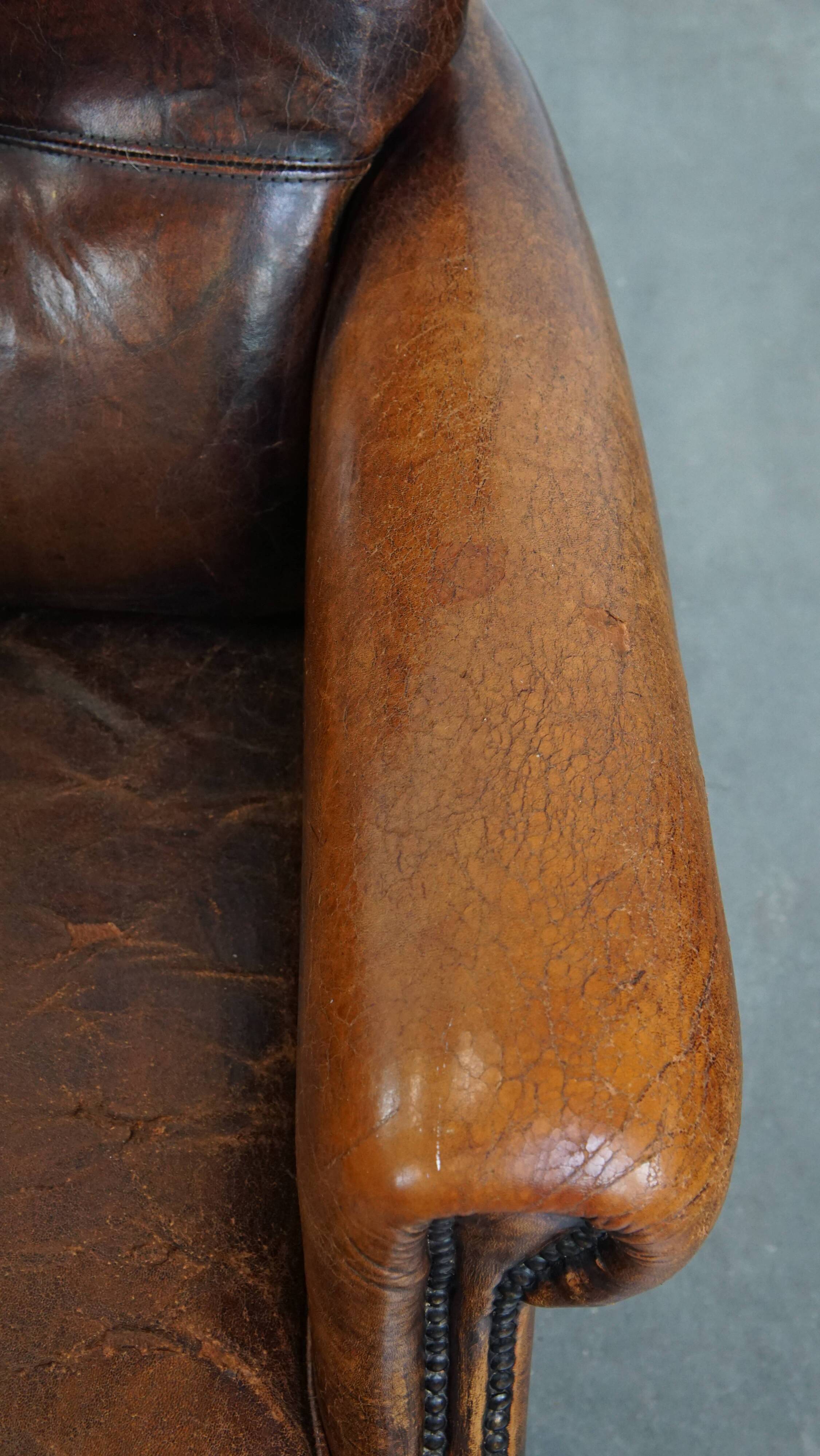 Fauteuil vintage en cuir de mouton avec dossier haut