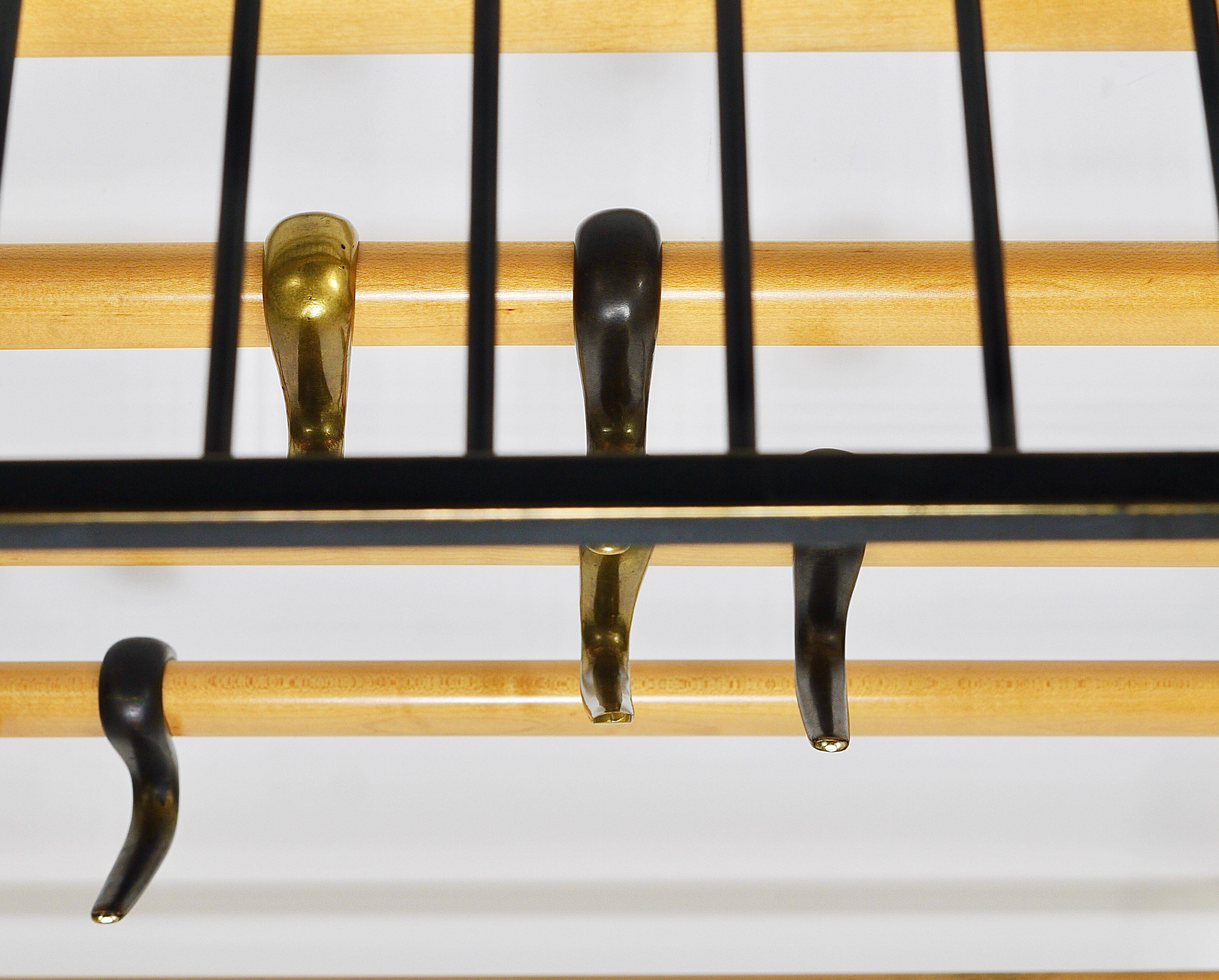 Rare coat rack by Carl Auböck with hat rack, cabinet, brass, walnut and beech, 1950s.