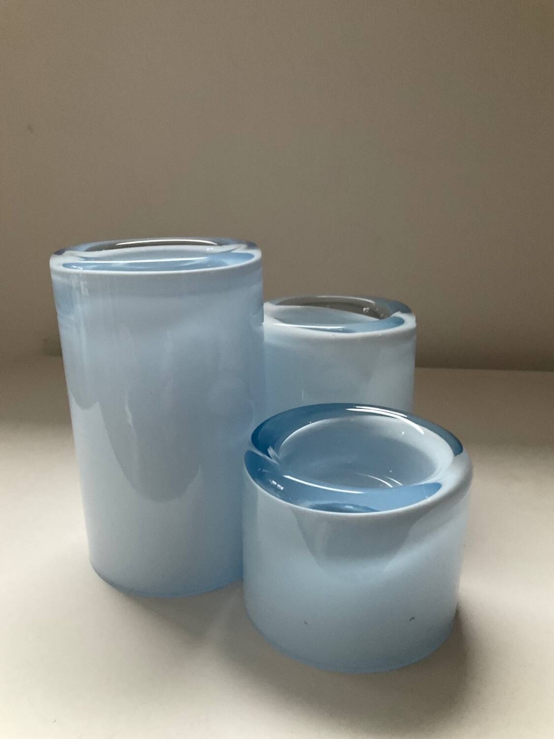 Trio of vintage candlesticks in double-layer glass paste