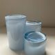 Trio of vintage candlesticks in double-layer glass paste