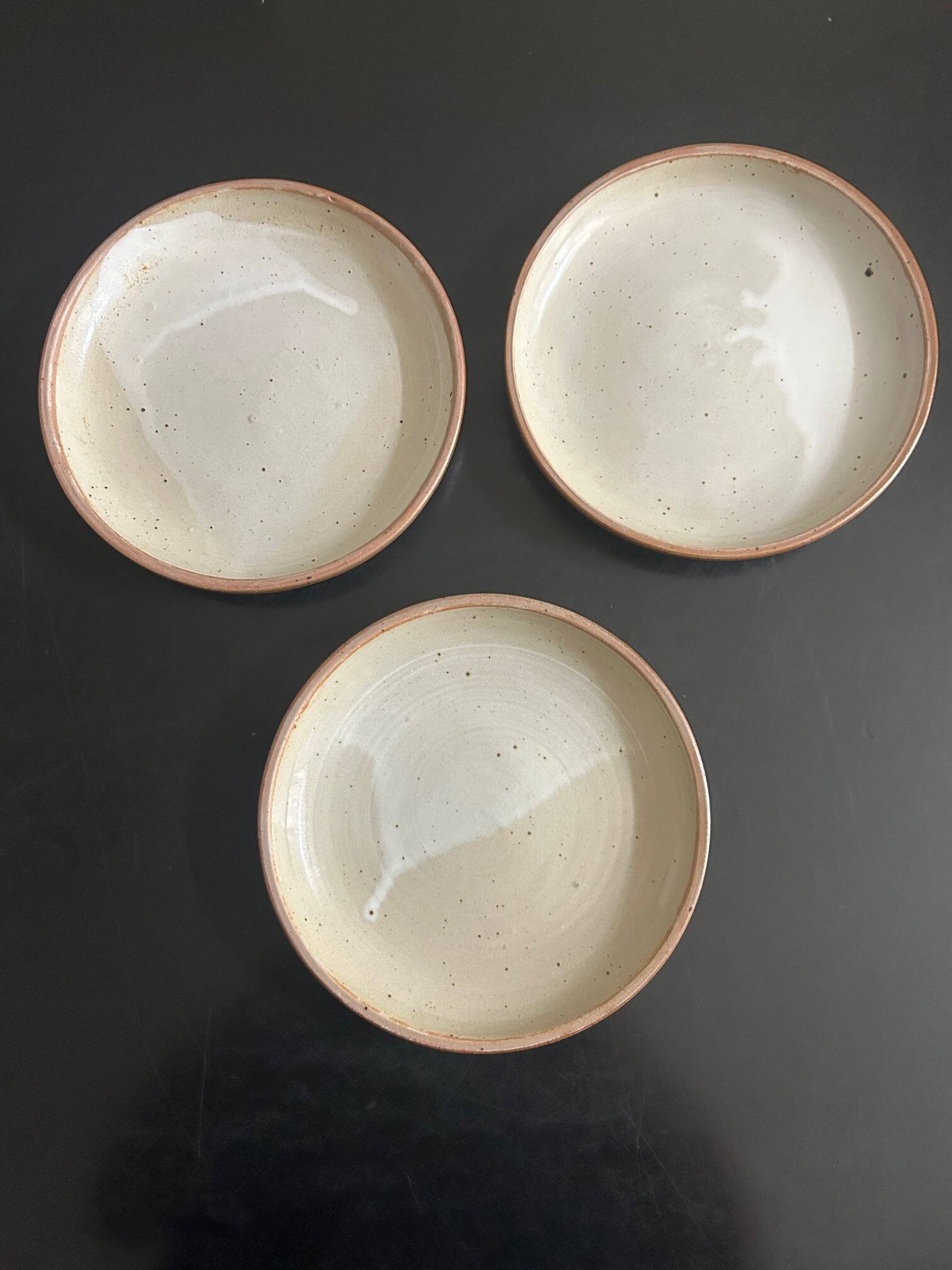 7 stoneware plates 1970