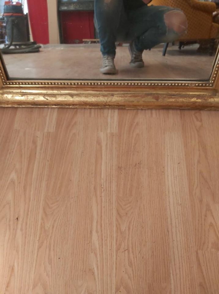 Golden Louis Philippe mirror with golden leafy