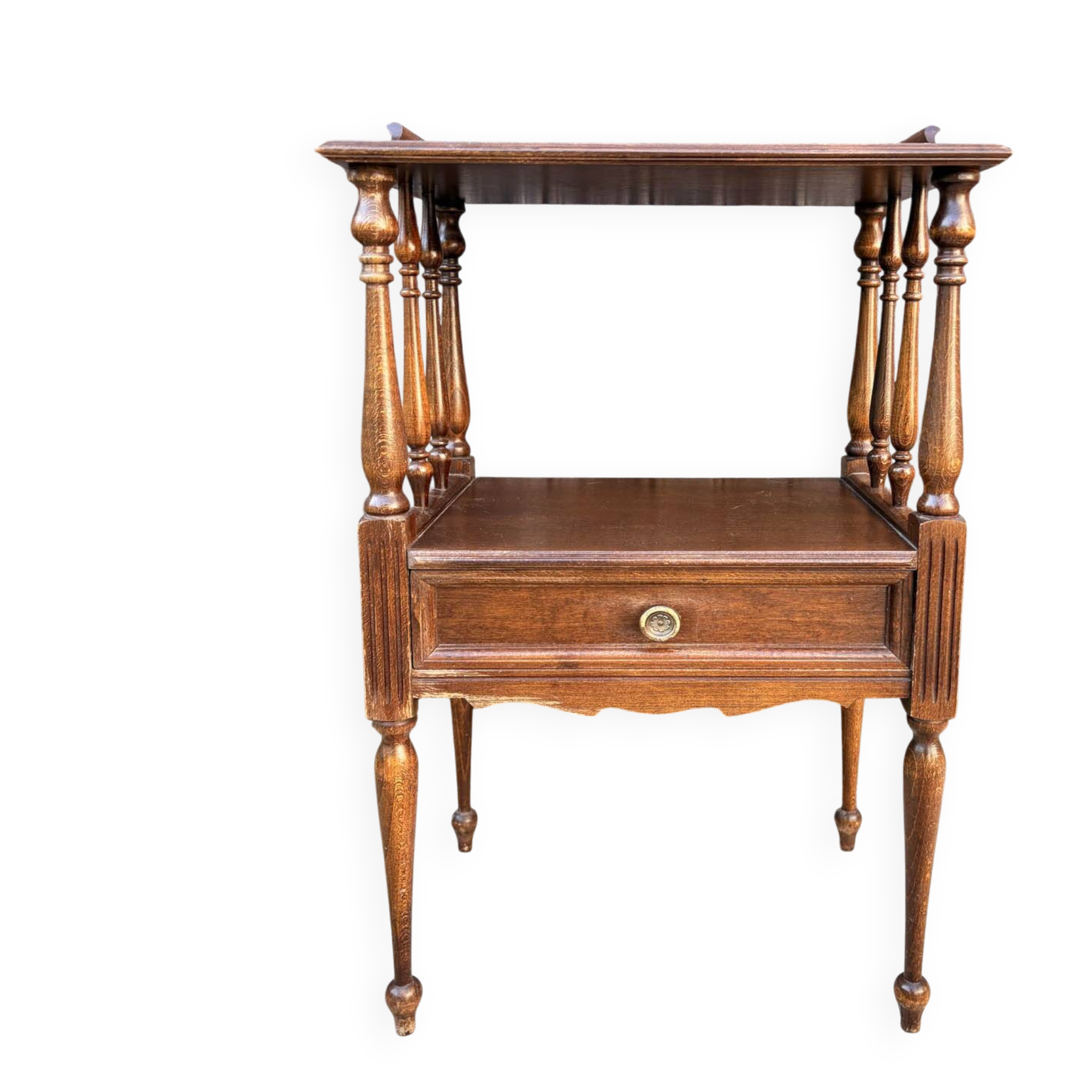 Solid wood bedside table with turned columns, early 20th century.
