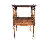 Solid wood bedside table with turned columns, early 20th century.