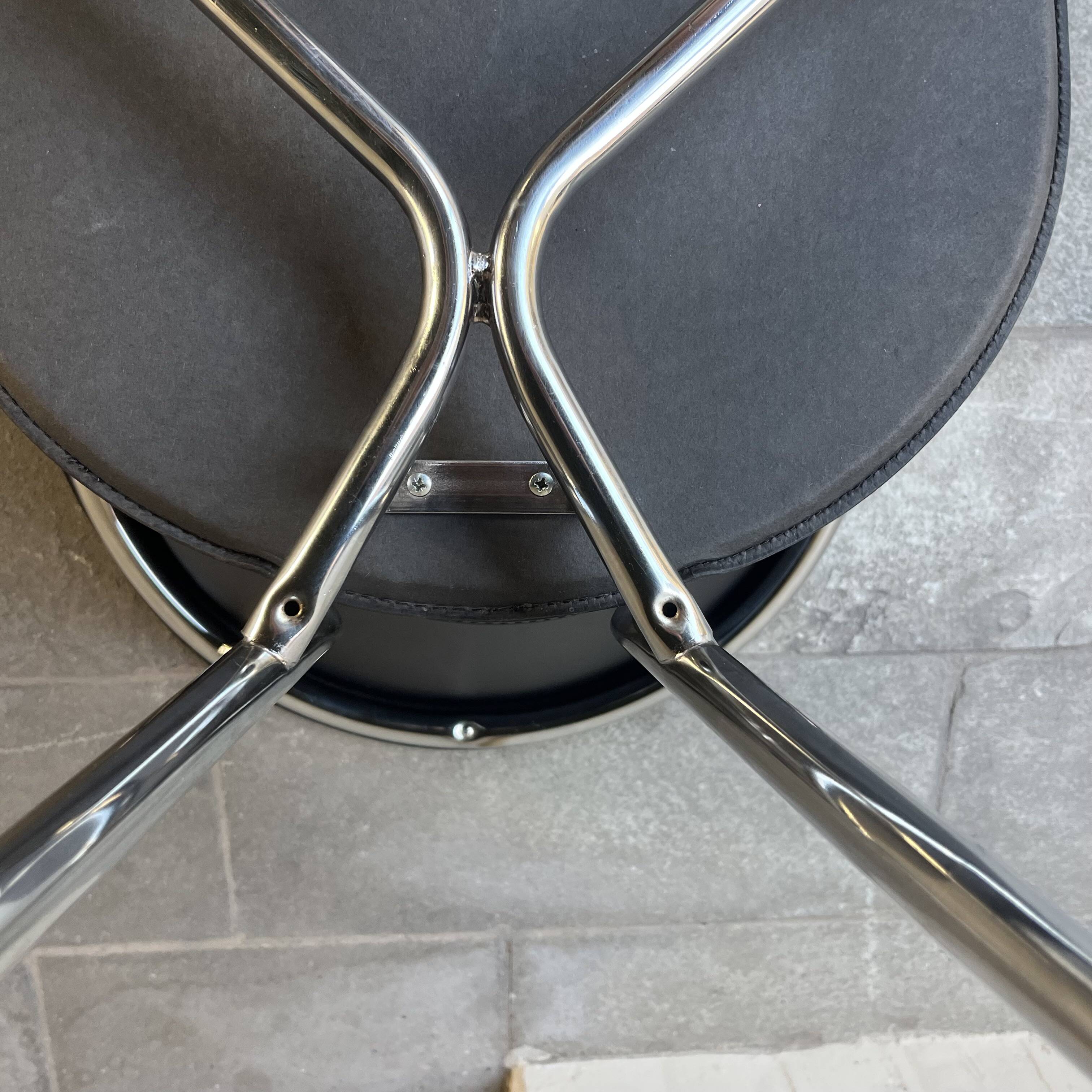 Set of four Italian black leather chairs, 1970