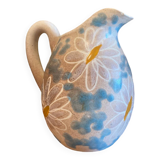 pitcher of daisies