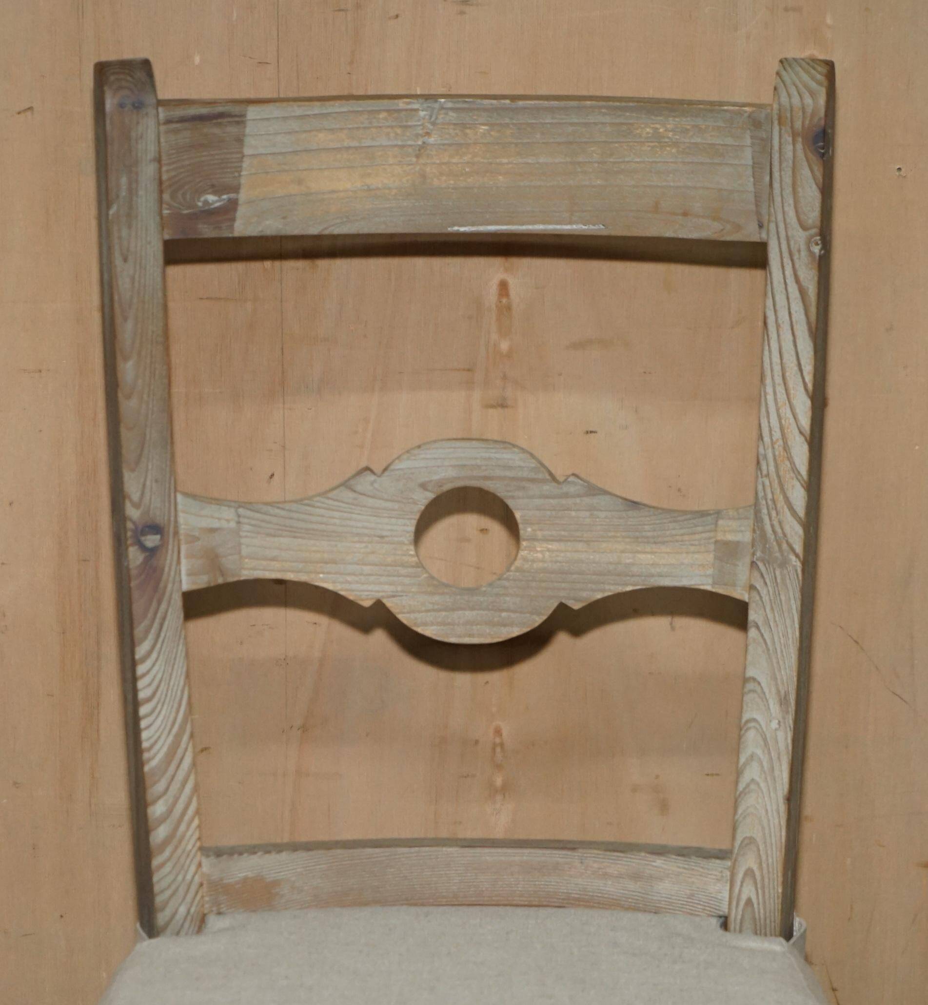 Pair of Swedish-style accent chairs in recycled pine with upholstered seats.