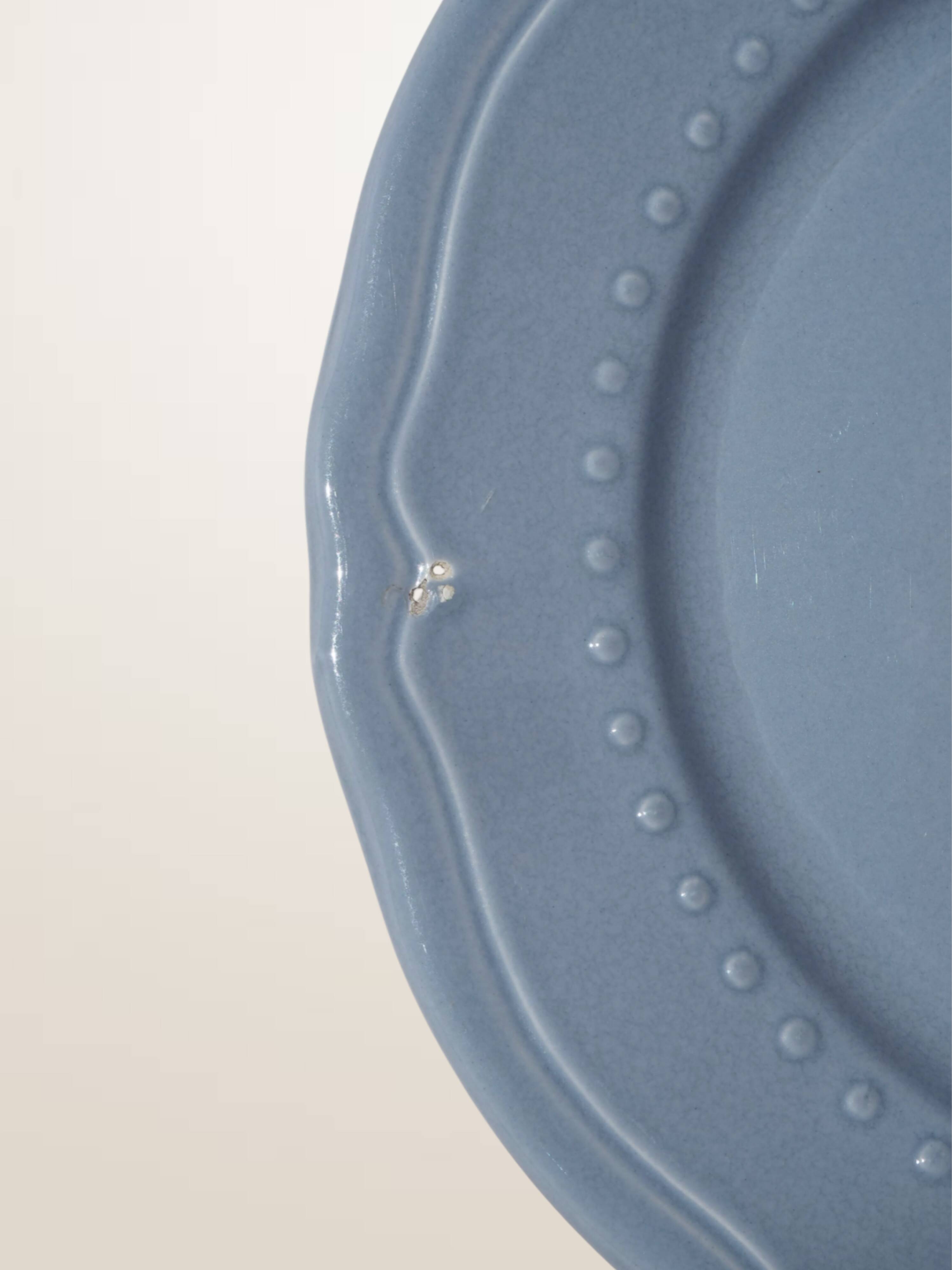 Set of 4 blue ceramic dessert plates.