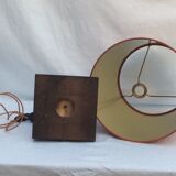 Brass lamp surrounded by leather with lampshade