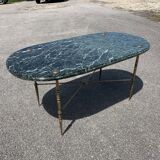 Oval coffee table in veined green marble