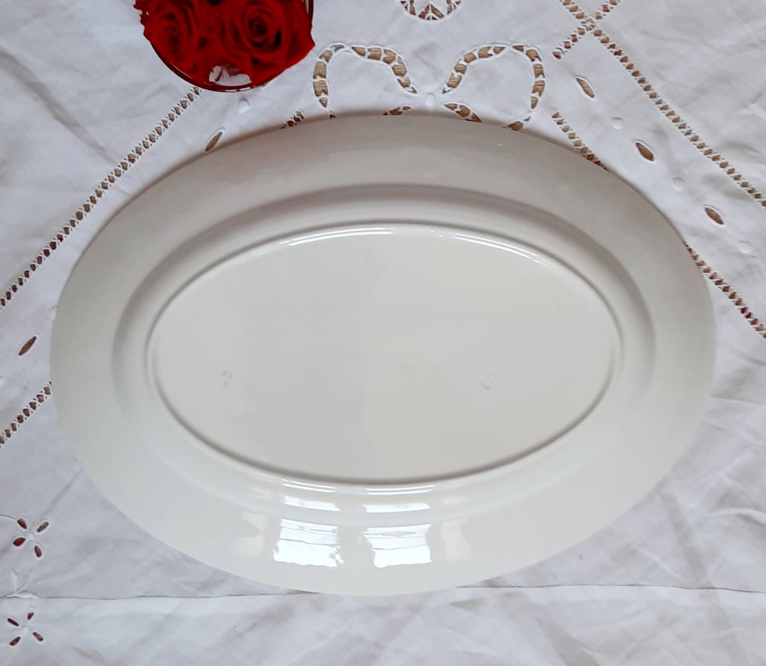 Old mismatched earthenware dinner plates with gold accompanied by a dish